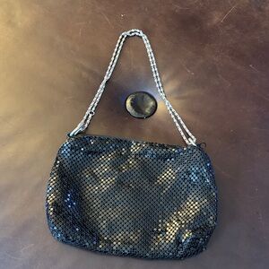 Black sequence evening bag with silver chain.